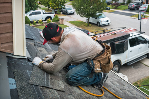 Professional Roofing technician working in North Liberty, IA